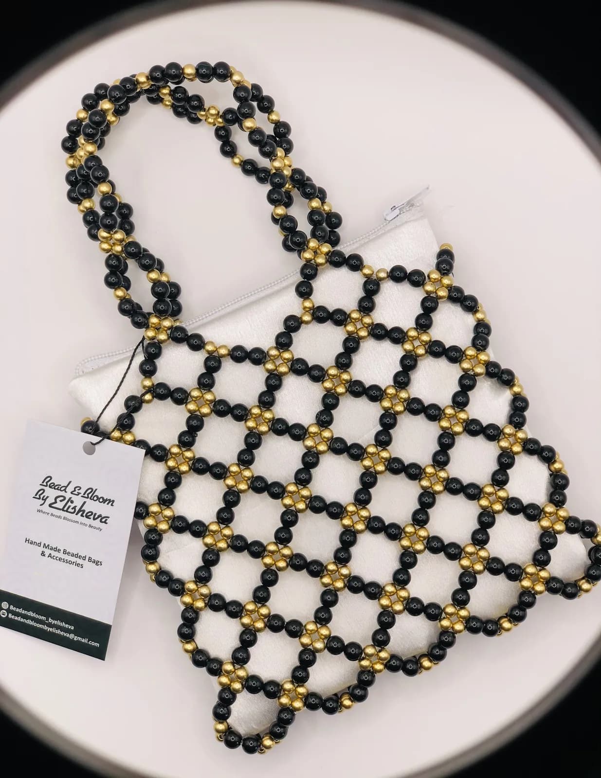 ÀDÌRẸ: Black and gold lattice tote, hand-strung in Onyx + Harmattan Gold