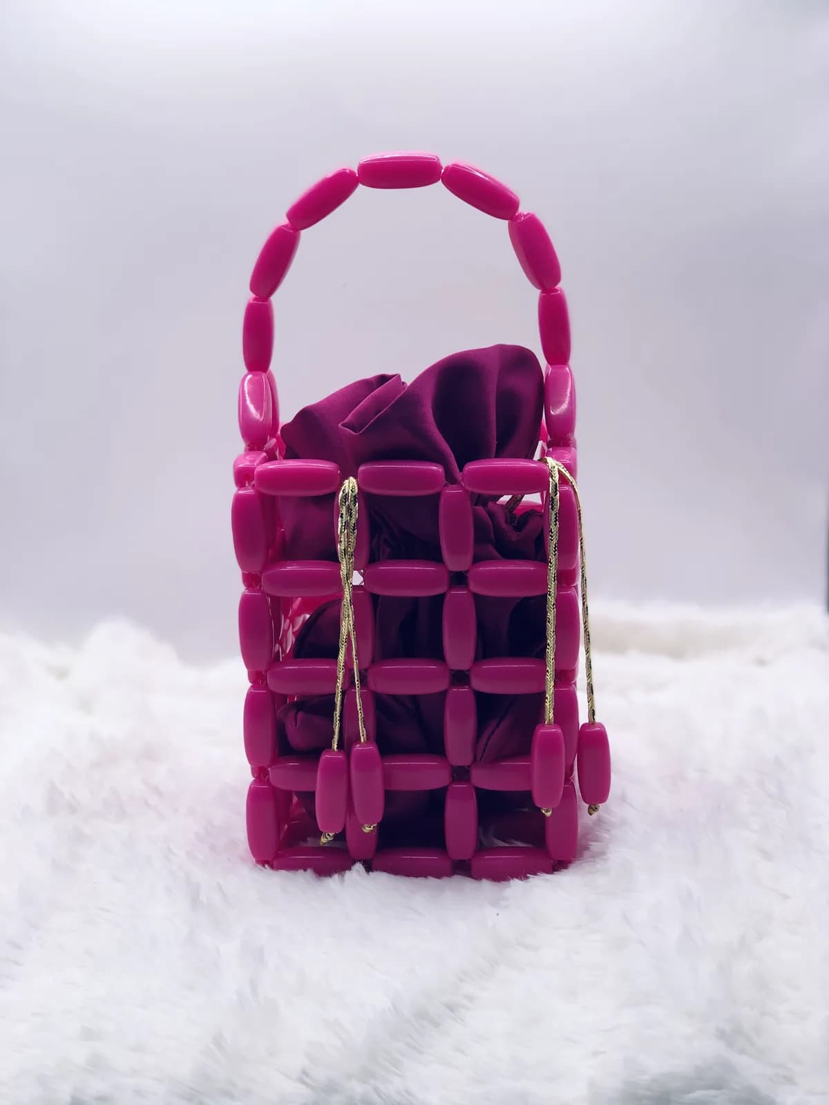 ÌYÁLÓDE: Magenta cage bucket, hand-strung in Wine