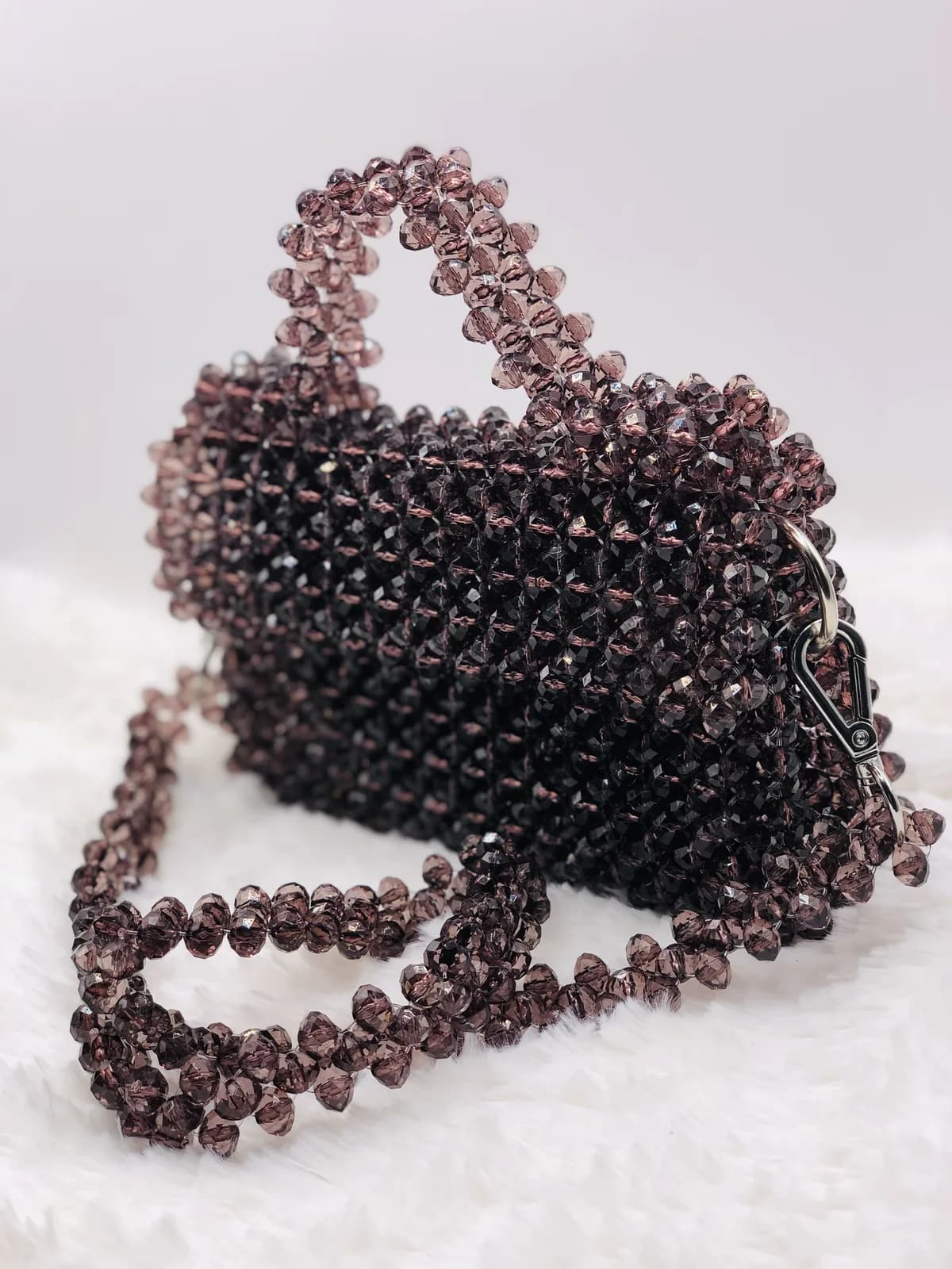 ÀṢAKÉ: Round beaded handbag in warm brown, made to order in Lagos, hand-strung in Brown