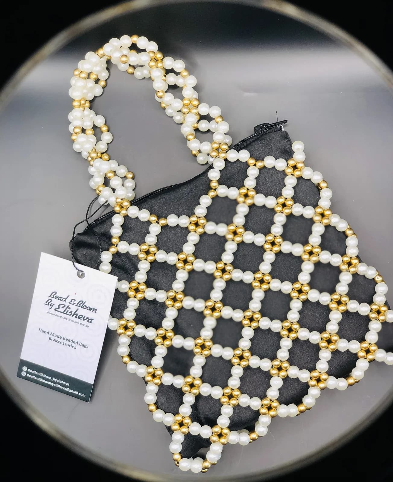 ÀDÚFẸ́: Pearl and gold net clutch, hand-strung in Pearl + Harmattan Gold