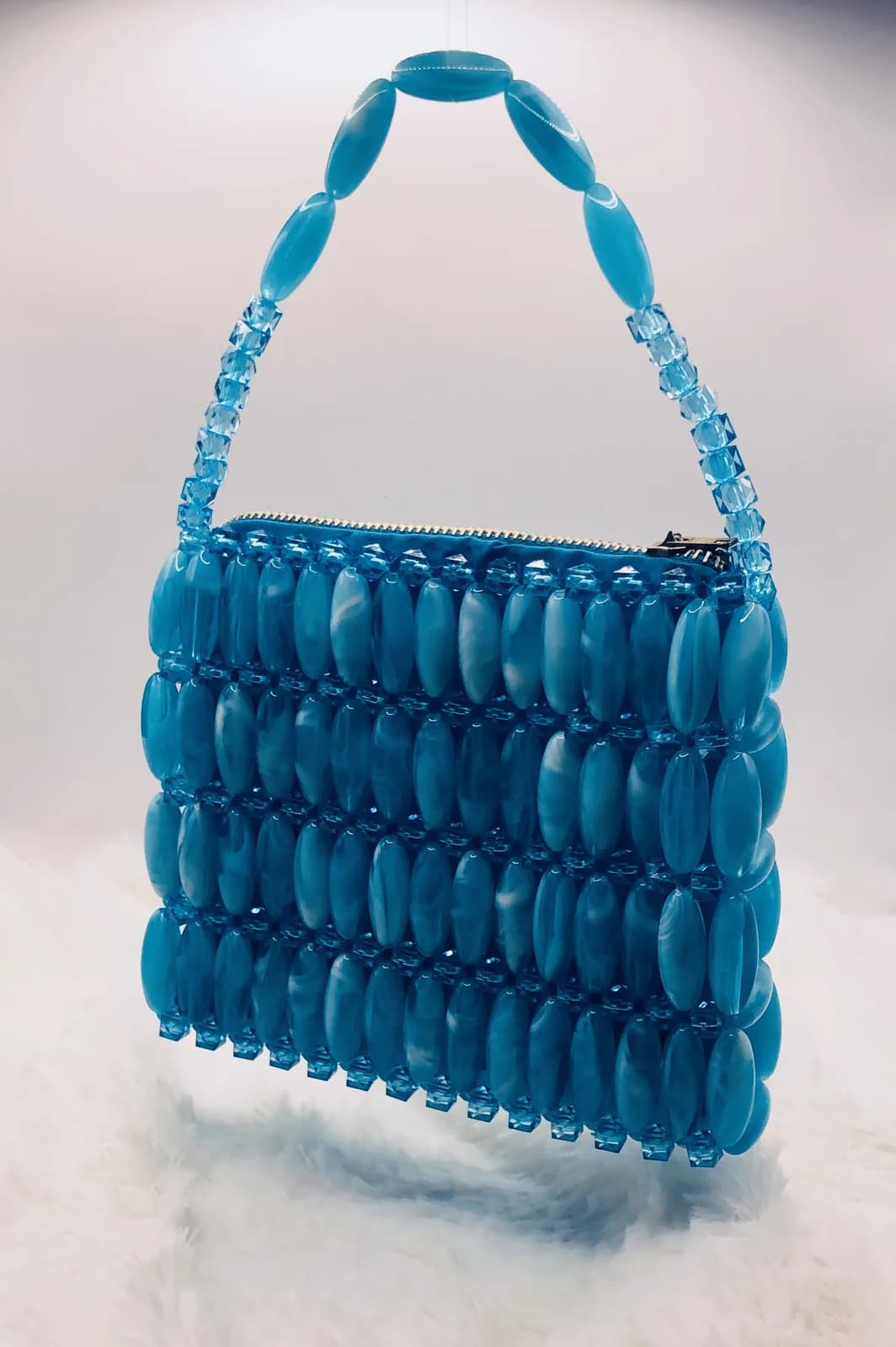 ÒJÚMỌ́: Aqua shoulder bag, hand-strung in Lagoon
