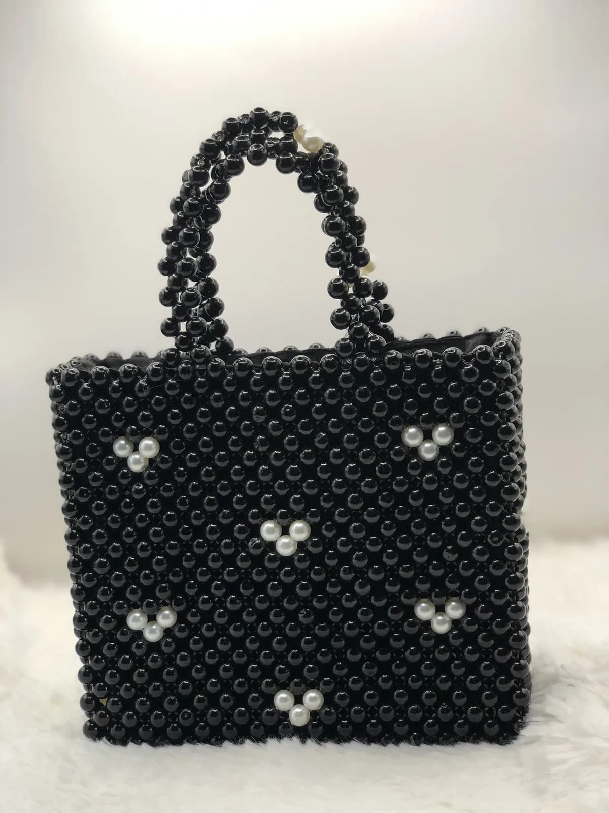 ÌRÀWỌ̀: Jet tote scattered with pearl, hand-strung in Onyx + Pearl