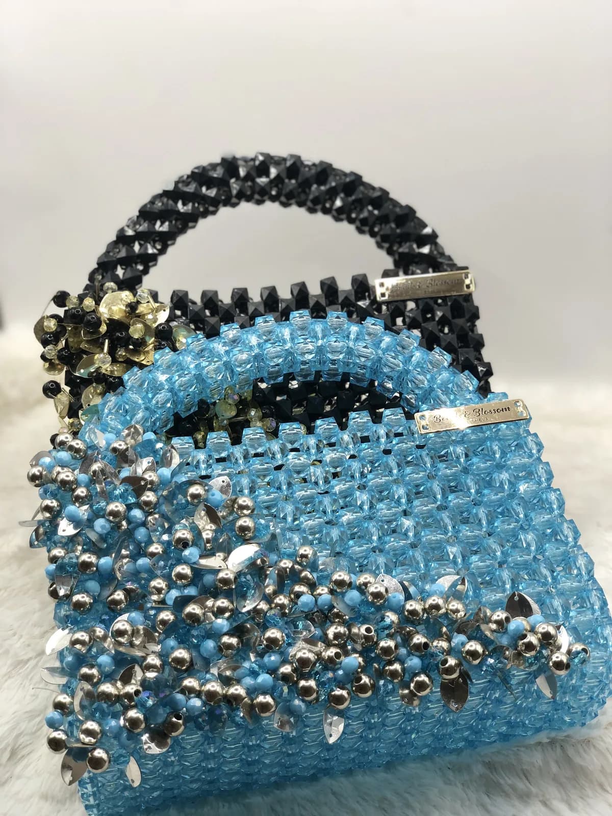 Close beadwork detail in silver and crystal