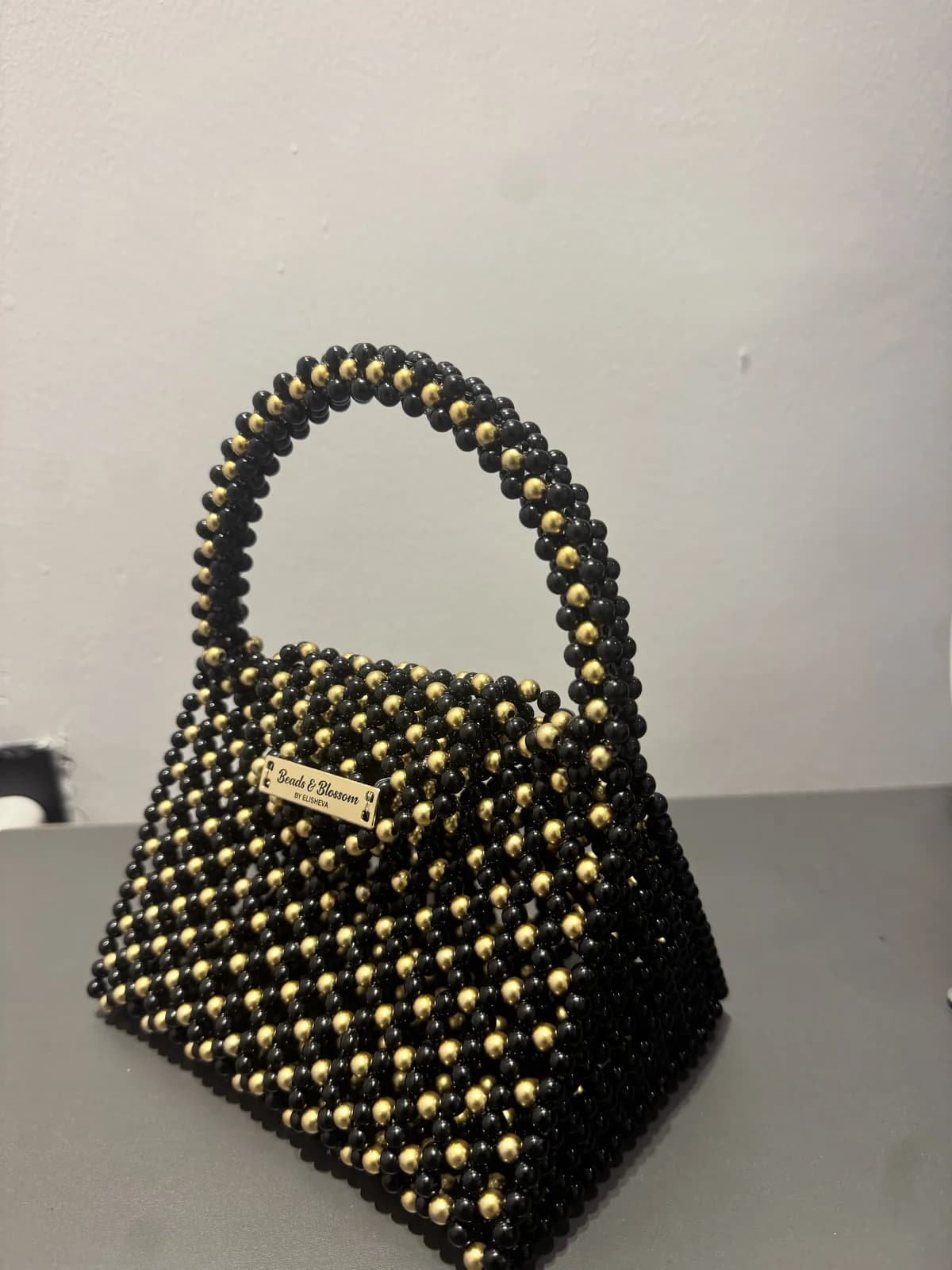 ỌLÁ: Black and gold faceted bag, hand-strung in Onyx + Harmattan Gold